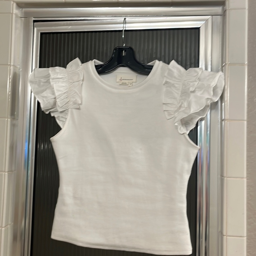 Special today -$25 price form. White knit shirt with ruffle sleeves